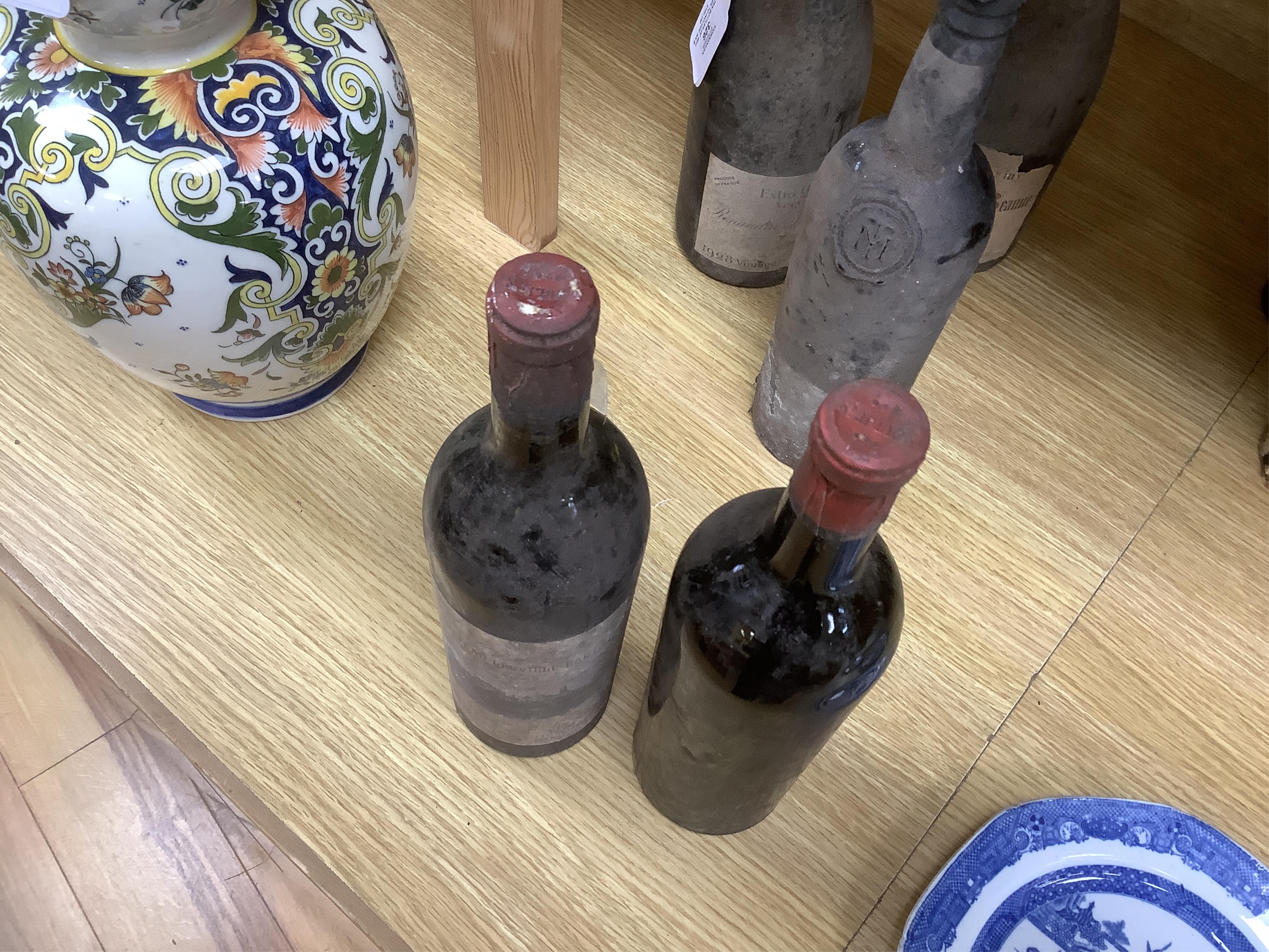 Ten bottles of red wines to include six bottles of mixed Claret/Bordeaux, four bottles Chateau de Ville-George’s, Grand Cru 1959, two bottles of Chateau Leoville Barton 1947 and two others without labels, a bottle Cau de